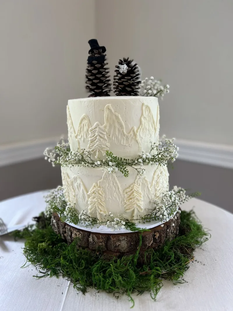 Woodland two-tier cake with pinecone toppers